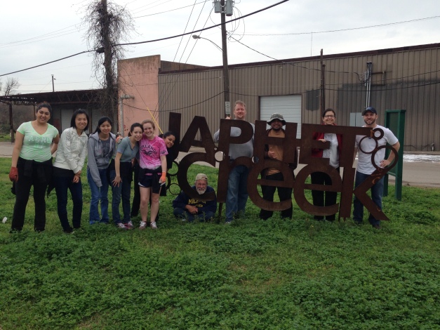 group photo with Japhet Creek metal sign